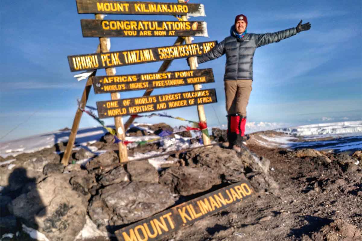 Bret McGowen at the summit of Mount Kilimanjaro in Tanzania